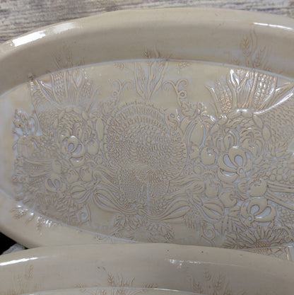 Decorative ceramic bowl with animal and food patterns on a wooden surface
