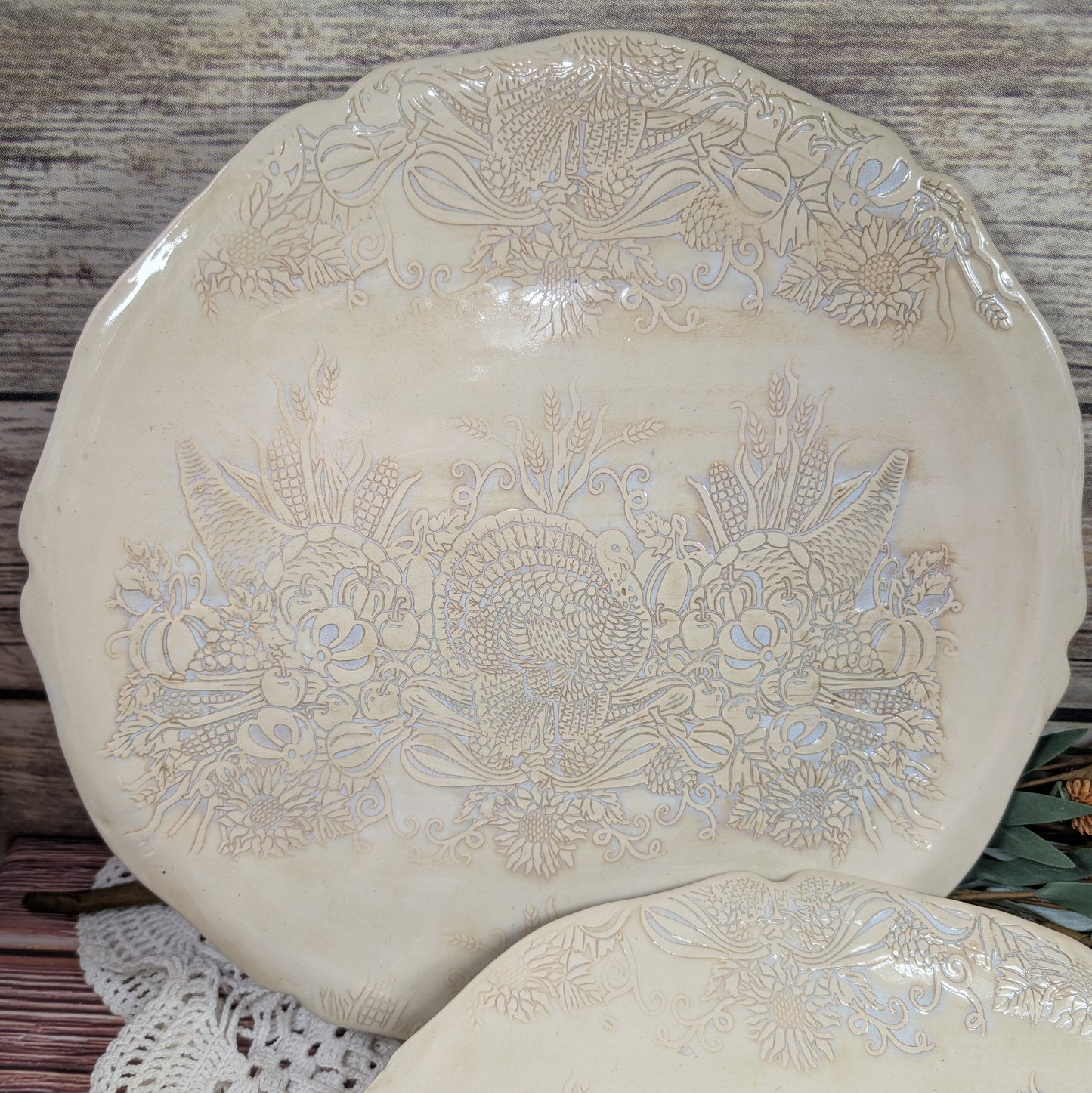 Decorative ceramic plate with floral patterns on a wooden surface