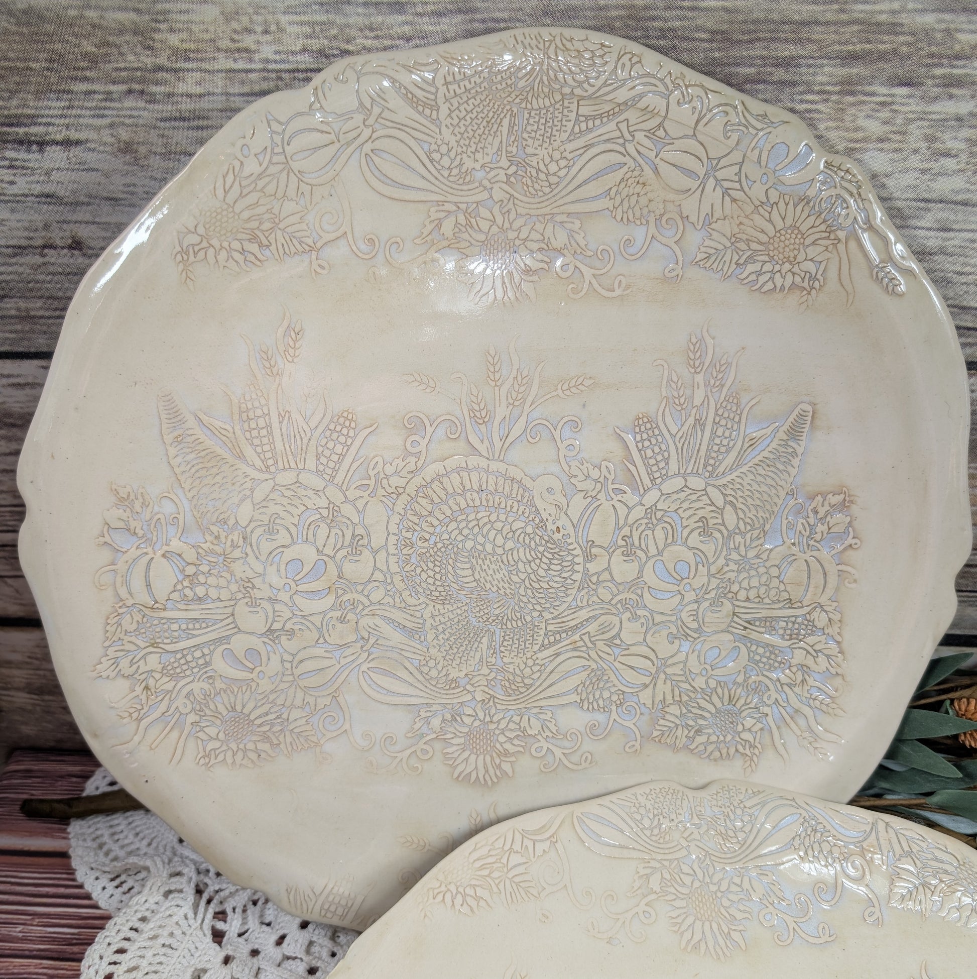 Decorative ceramic plate with floral patterns on a wooden surface